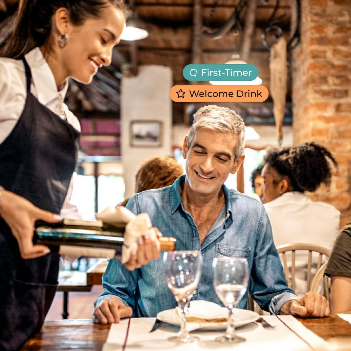 Image of a Waiter Pouring a Drink